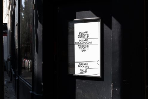 Outdoor square poster mockup in urban shadowed alley, ideal for presenting branding designs and advertisements, high resolution, realistic textures.